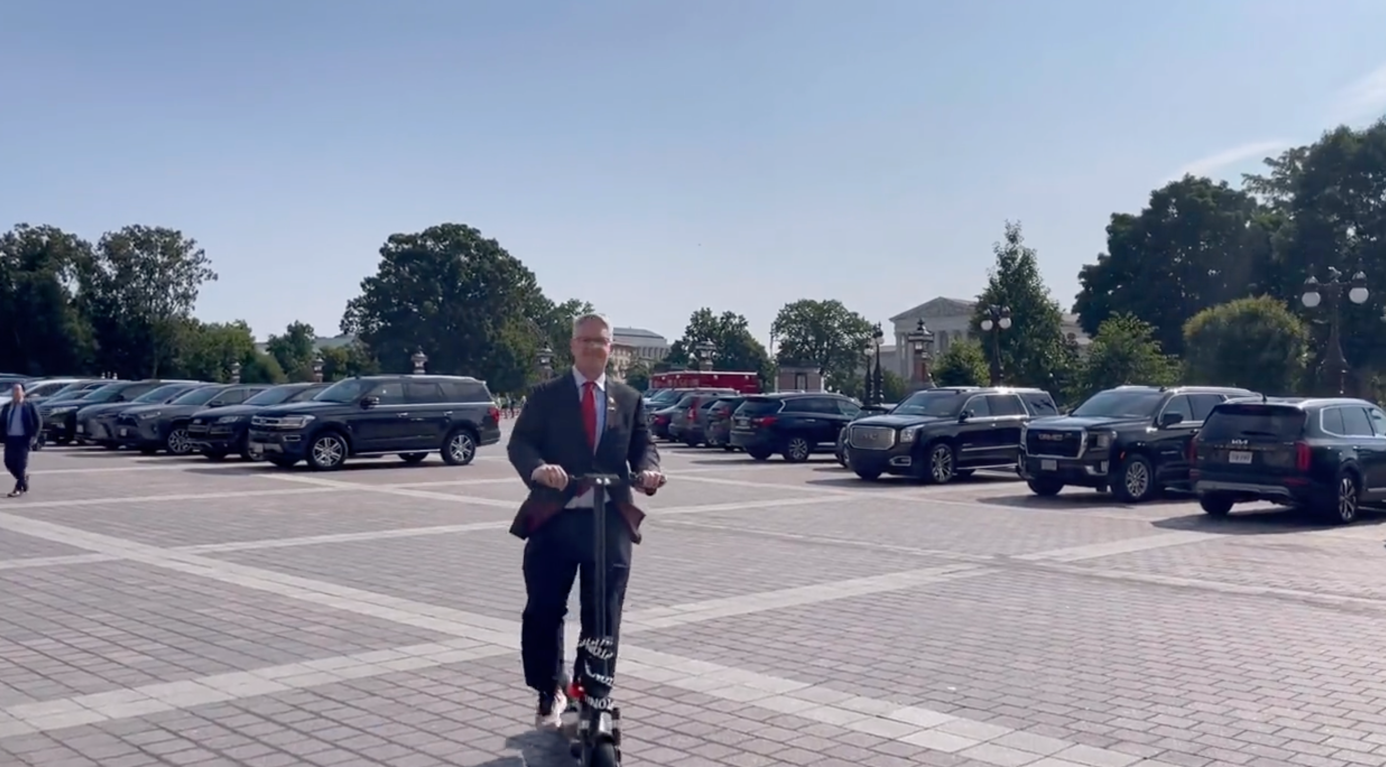 Rep. Williams rides scooter up to his hearings for the day